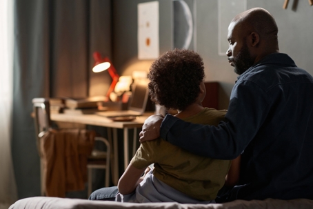 father and child hugging